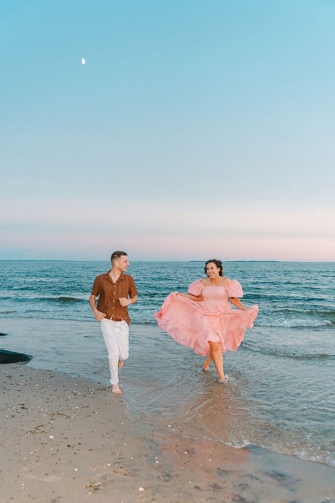 couple running on the beach under the moon